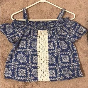 A size 14 Justice off the shoulder shirt.